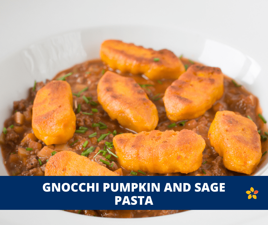 Pumpkin Gnocchi on a plate with meat sauce for this easy recipe for fall.