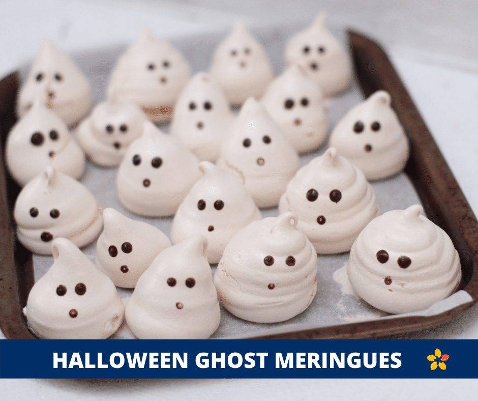Ghost Meringues on a sheet pan for this Halloween Recipe.