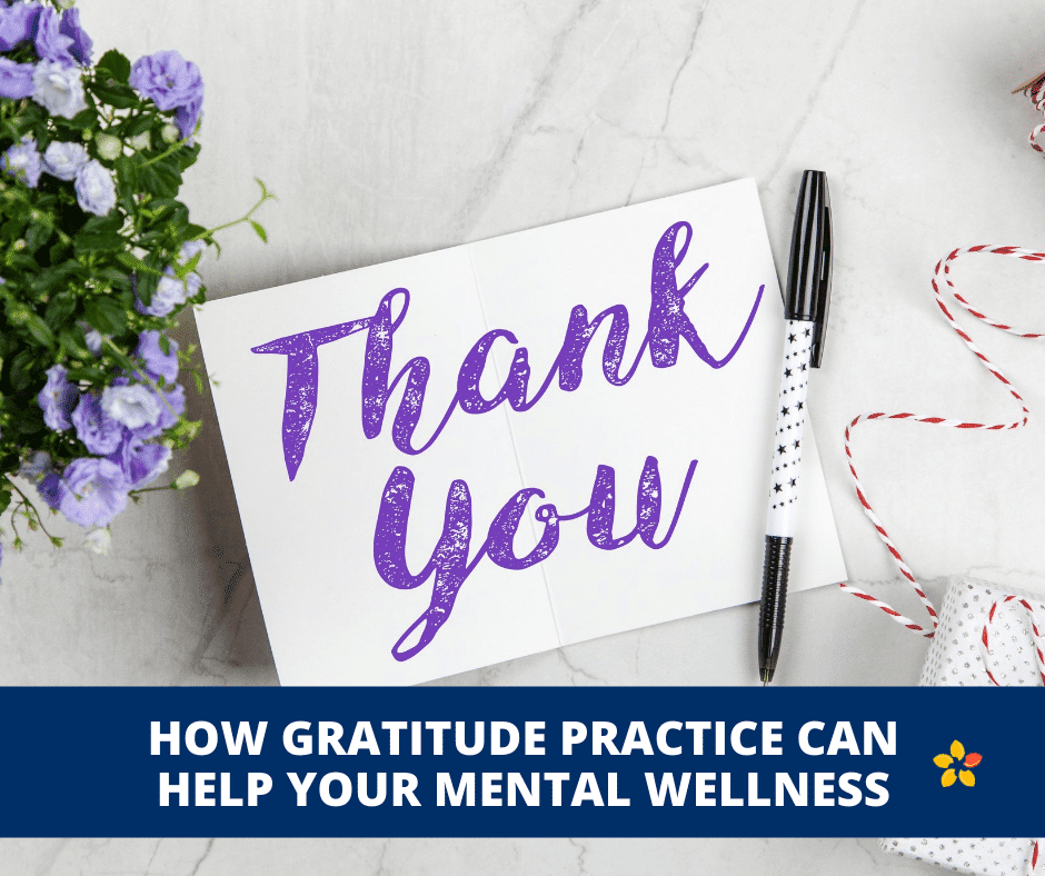 A thank you card sits on a desk as a sign for practicing gratitude for mental health.